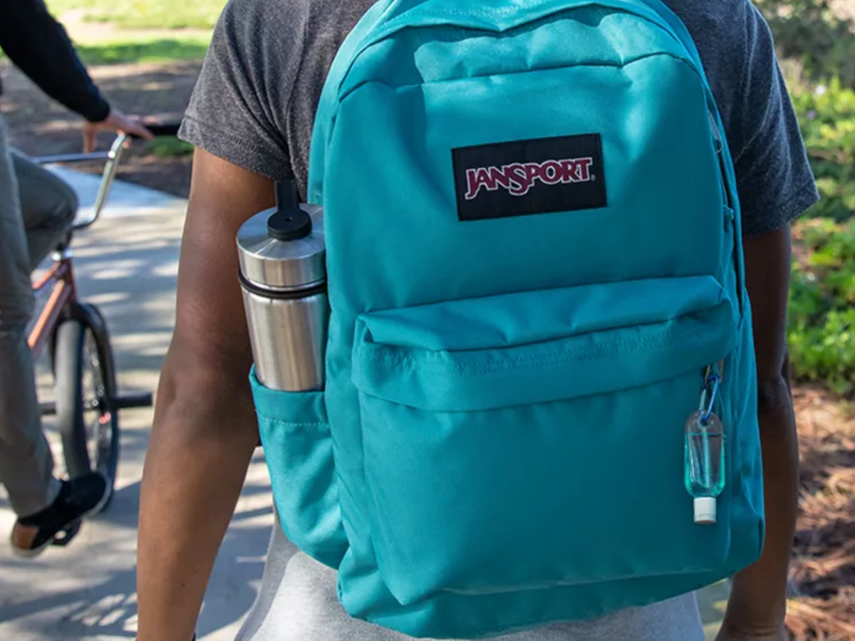 attaching purell to your hiking backpack How to Always Keep Your Hand Sanitizer in Reach